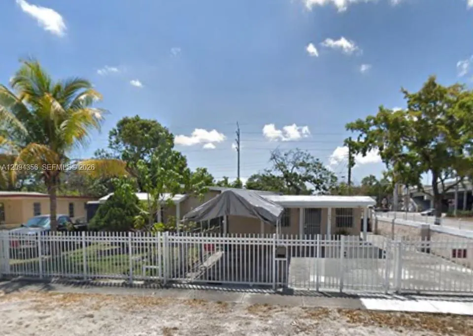 View details of listing 580 NW 136th Street, North Miami, FL 33168 North Miami with MLS#