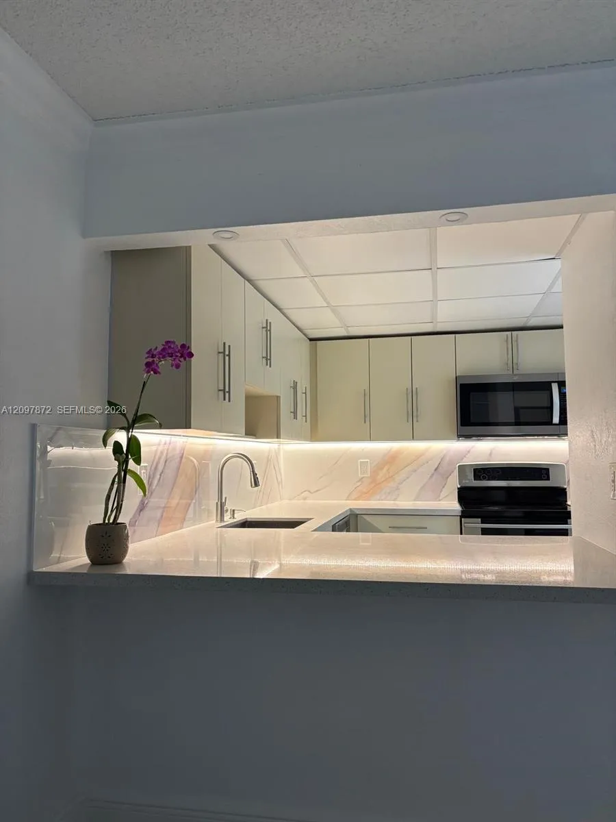 View details of listing 6930 Miami Gardens Drive 1-103, Hialeah, FL 33015 Hialeah with MLS# 
