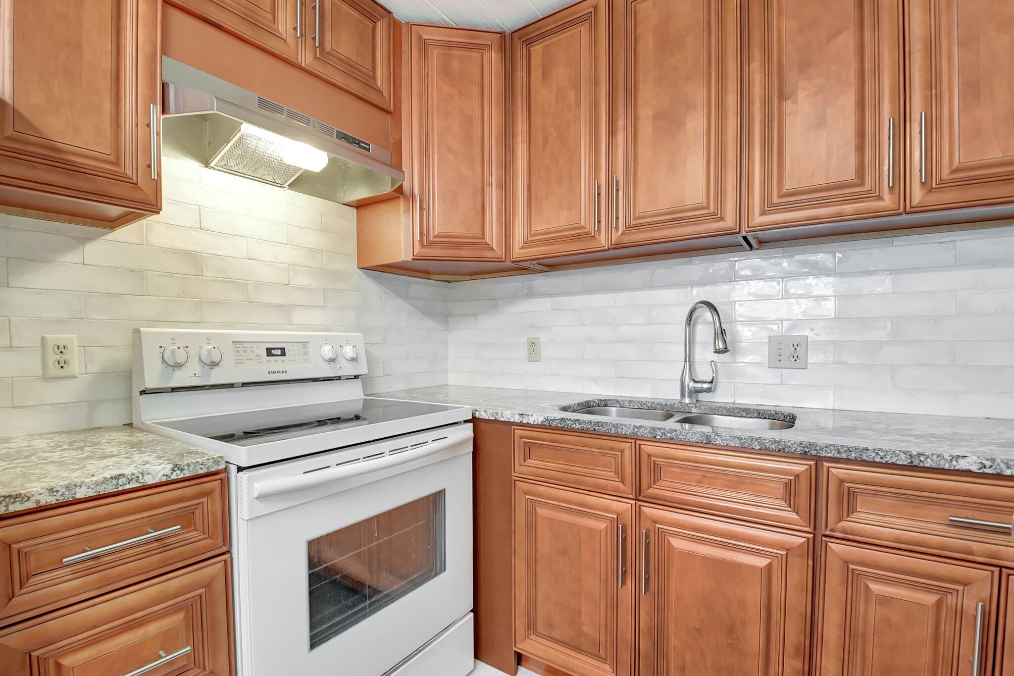 View details of listing 400 Village Green Circle W 212, Palm Springs, FL 33461 Palm Springs with MLS#